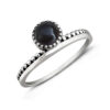 Onyx circle beaded sterling silver ring with black gemstone cabochon and textured band design.