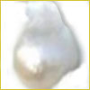 Close-up of an irregularly shaped white pearl with a shiny, smooth surface on a plain white background.