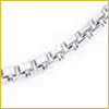 Close-up of a silver chain necklace with rectangular links against a white background.