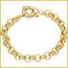 Gold chain bracelet with round links and a toggle clasp, displayed on a white background with a thin gold border.