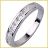 A silver band ring with a row of small, square-cut clear stones set into the top.