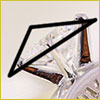 A clear diamond with a bold black outlined triangle drawn over part of the gem, set against a light background.
