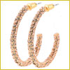 Pair of textured, gold-toned hoop earrings with a sparkly, encrusted design against a white background.