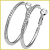Pair of silver hoop earrings with a textured, patterned surface, displayed against a plain white background.