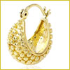 Gold hoop earring with intricate textured design and small raised bead-like patterns on its surface.