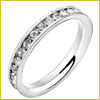 Silver ring with a row of small, clear gemstones set around the entire band, shown on a white background.
