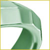 Close-up of a shiny, faceted green ring with a geometric design against a white background.