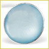 A round, light blue pill with a smooth surface is shown against a white background.