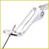 A close-up of a silver nail clipper with its lever raised, ready to trim a fingernail.