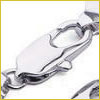 Close-up of a shiny silver lobster clasp connecting two chain links, likely part of a jewelry piece.