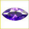 A faceted, marquise-cut purple gemstone displayed on a white background.