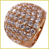 A gold ring with a wide band, covered in multiple rows of sparkling round diamonds on the surface.