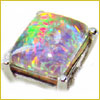 Rectangular opal gemstone with vibrant rainbow colors set in a silver metal prong setting.