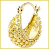 Gold hoop earring with textured, raised dot pattern, shown against a white background with a thin gold border.