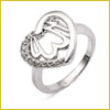 Silver ring with a heart-shaped design and small decorative stones on the band, displayed on a white background.