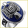 Silver class ring with a dark blue stone and an engraved emblem, showing a D and a decorative design on top.