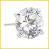 A close-up of a round diamond stud earring set in a four-prong metal setting.
