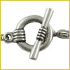 Close-up of a silver toggle clasp, commonly used for fastening bracelets or necklaces.