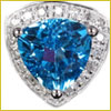 A triangular blue gemstone set in a diamond-studded, triangular-shaped silver or platinum ring setting.