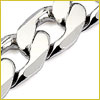 Close-up of a shiny, silver chain with thick, interlocking links on a white background.